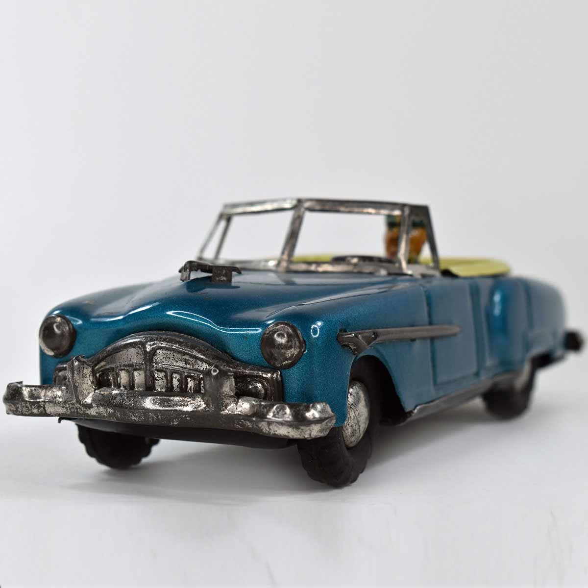 https://www.unclealstoys.com/wp-content/uploads/2021/06/EARLY-50S-TIN-FRICTION-PACKARD-CONVERTIBLE-OPEN-CAR-W-DRIVER-JAPAN-12.jpg